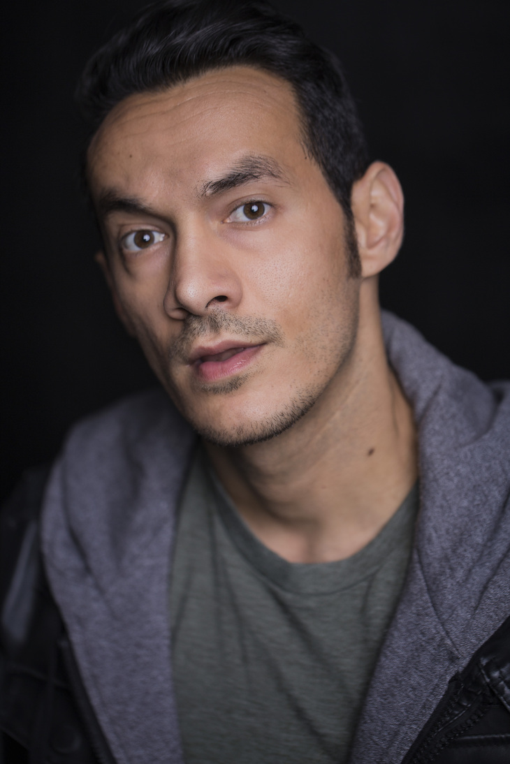 Ned Yousef, direct gaze, dark backdrop