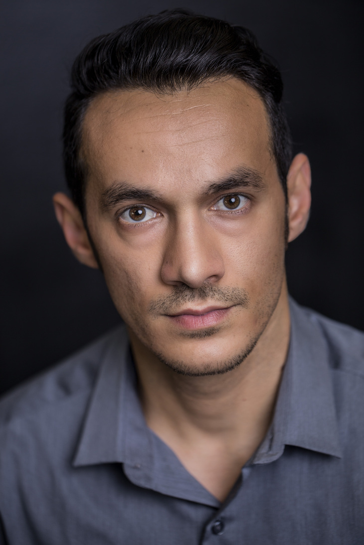 Ned Yousef, three-quarter studio portrait, neutral expression